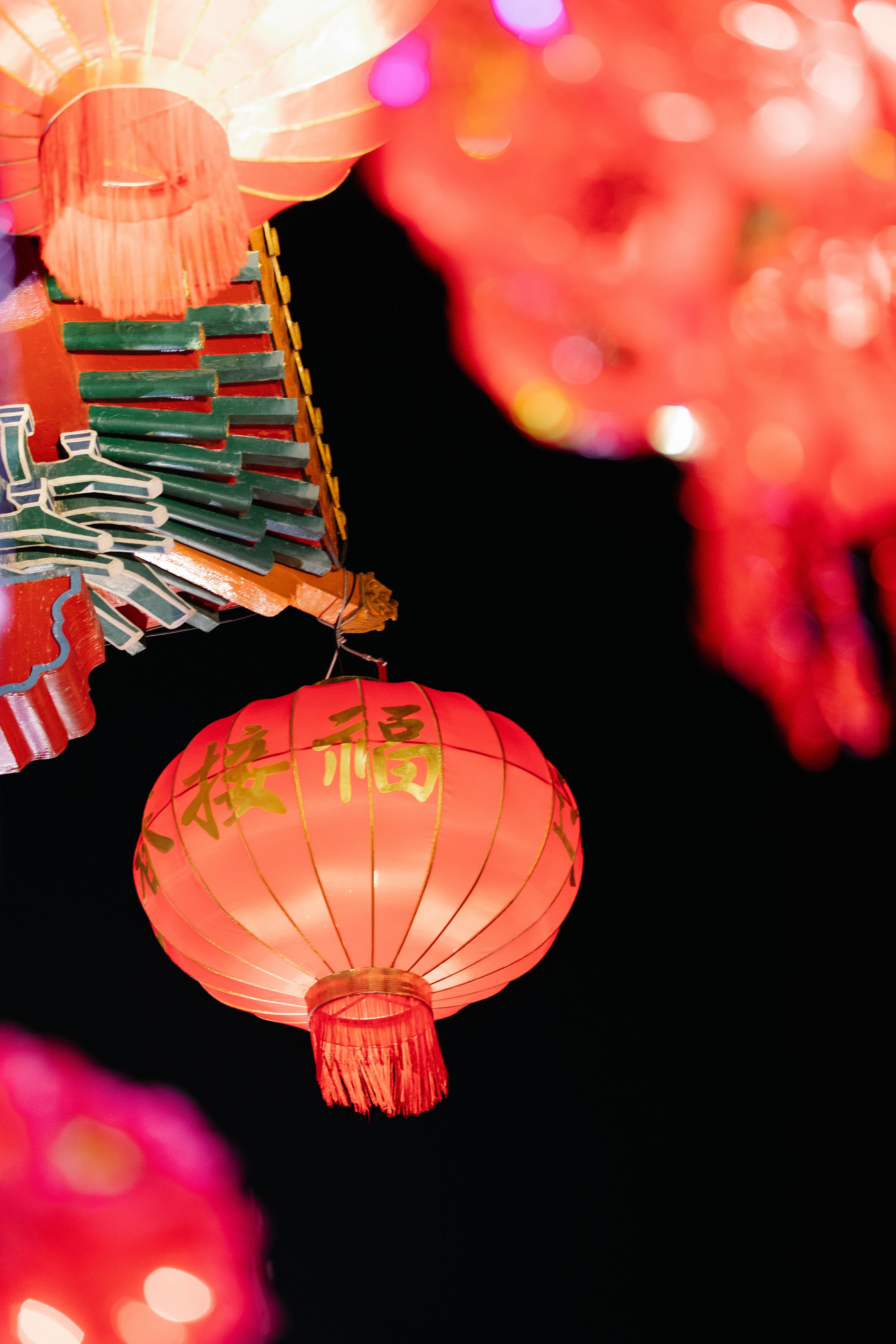 colorful lantern and chinese decor hanging against dark sky