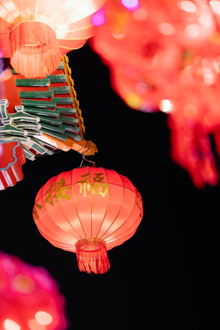 Colorful Lantern And Chinese Decor Hanging Against Dark Sky