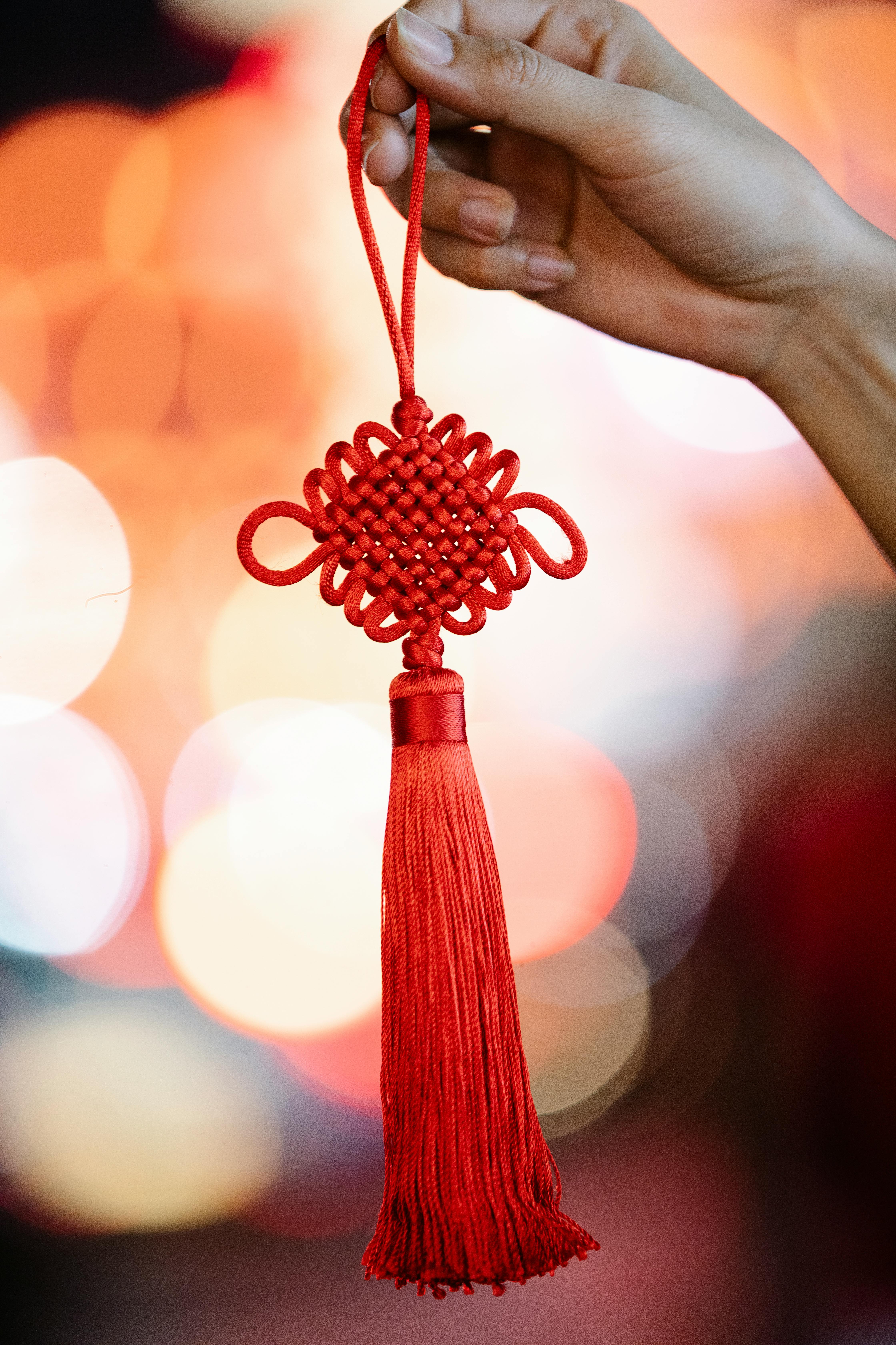 woman showing red chinese knot