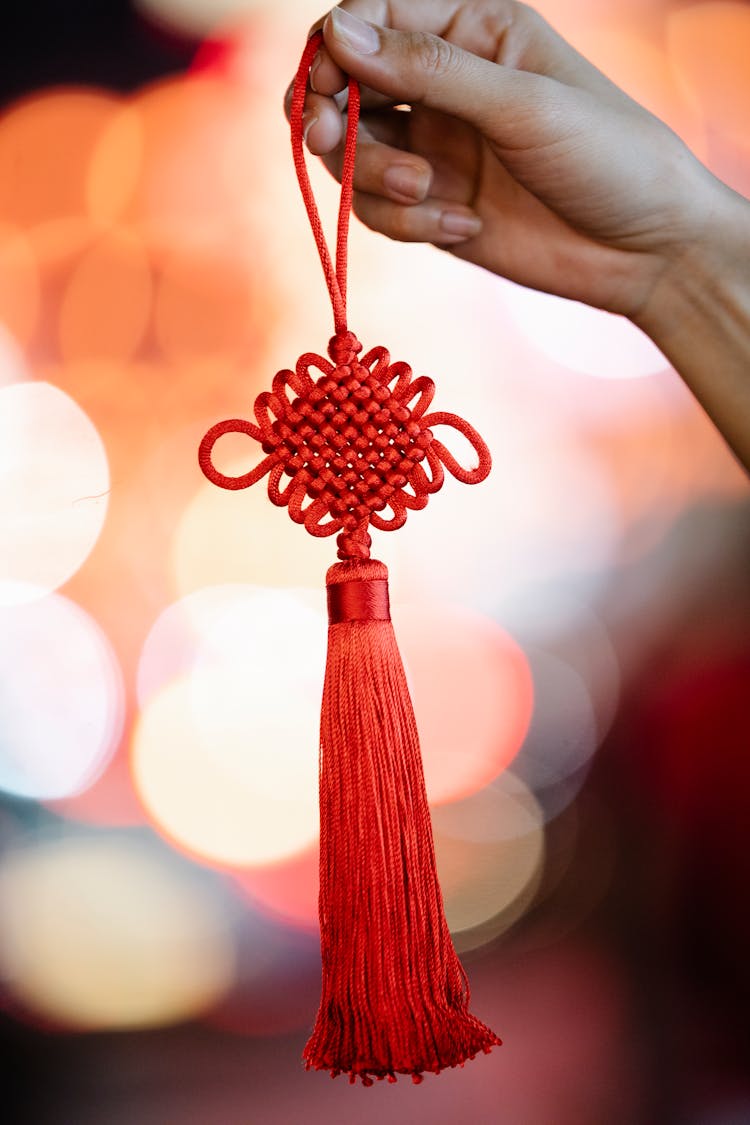 Woman Showing Red Chinese Knot