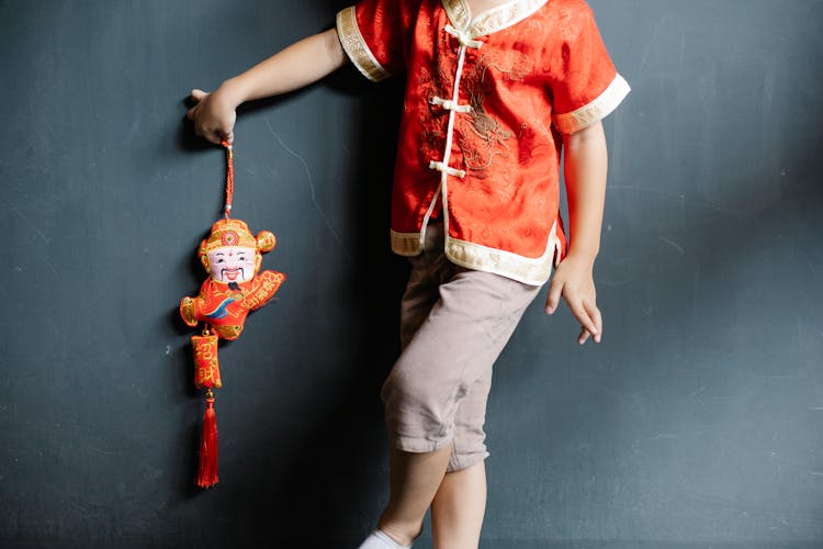 Little Boy With Chinese Toy For New Year