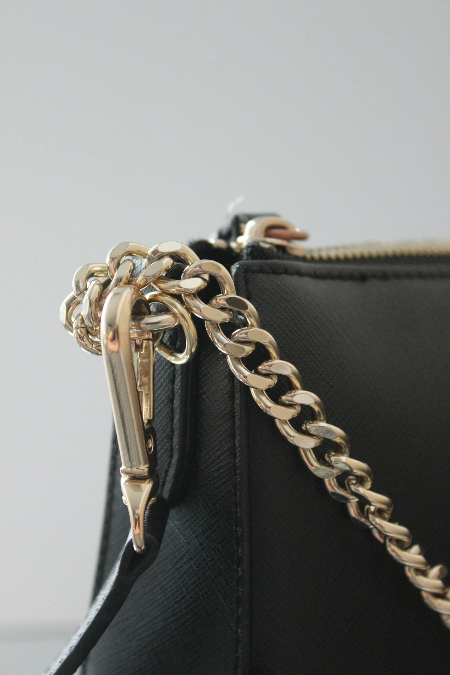 A Black Bag with Gold Chain · Free Stock Photo
