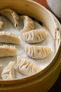 Traditional oriental dumplings in bamboo steamer