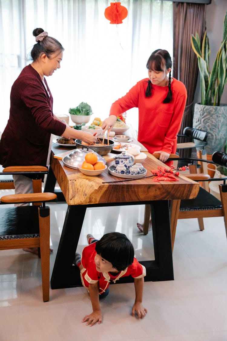 Old Asian Woman Cooking Chinese Food With Granddaughter