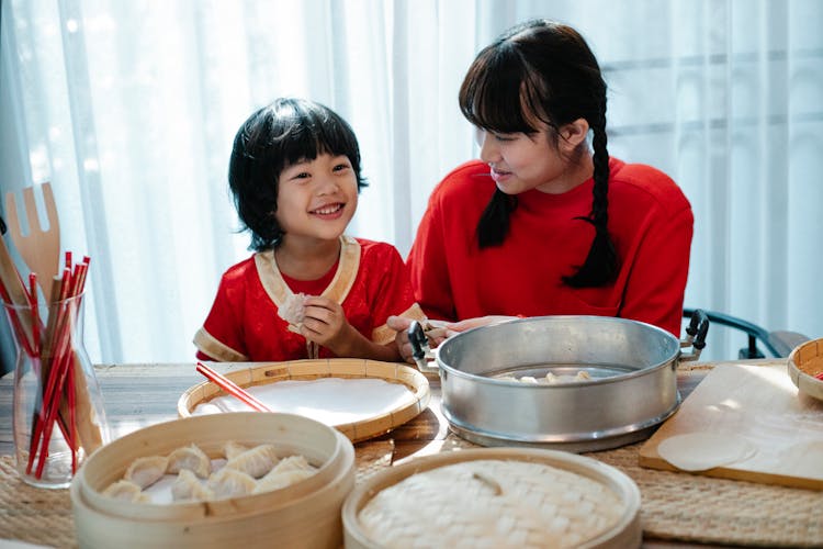 Siblings Learning How To Make Dumplings