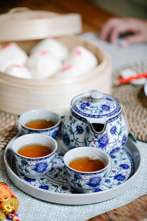 Free Traditional tea set and Chinese baozi served on table Stock Photo