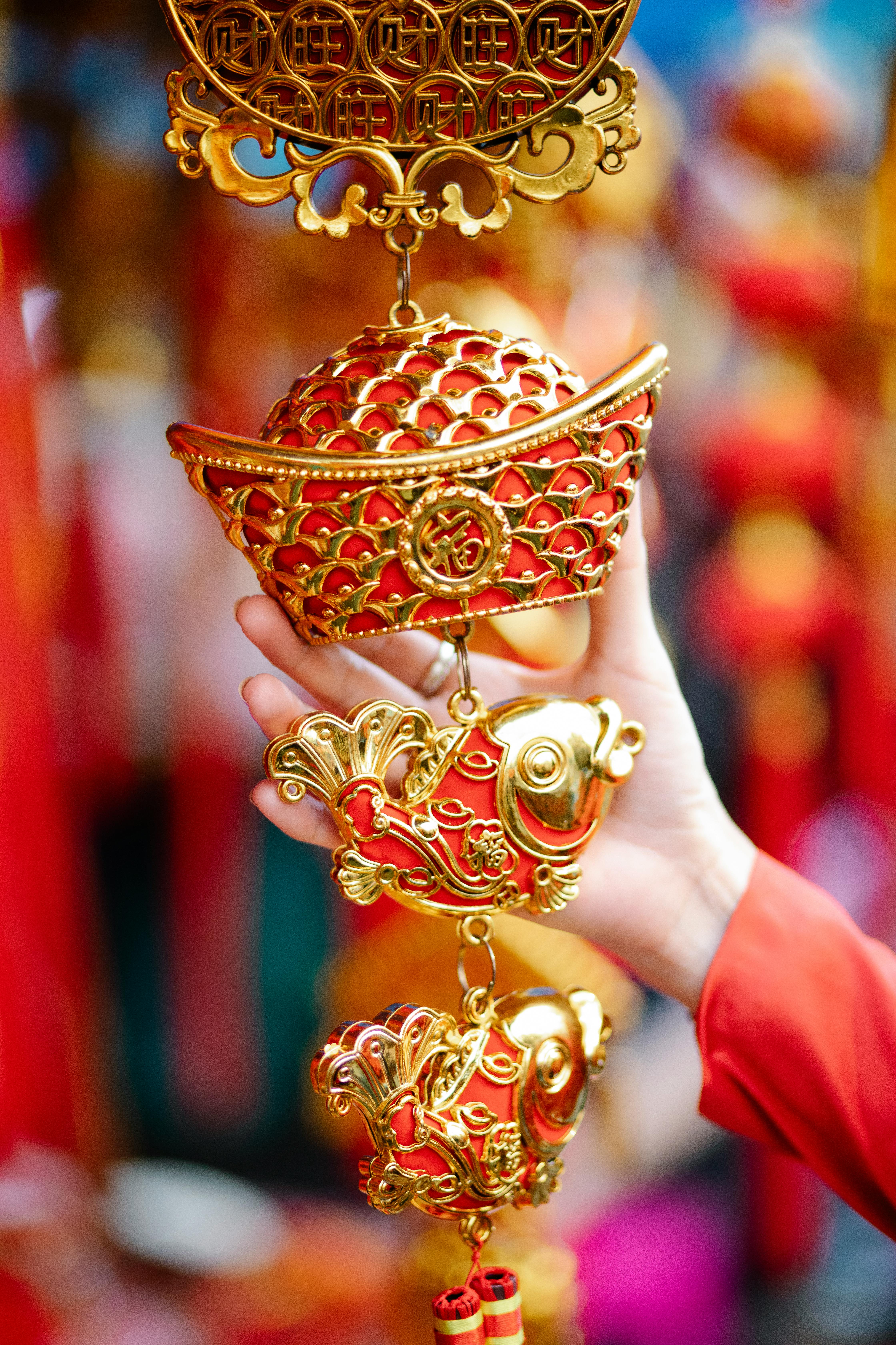 unrecognizable woman choosing decoration during traditional chinese spring festival