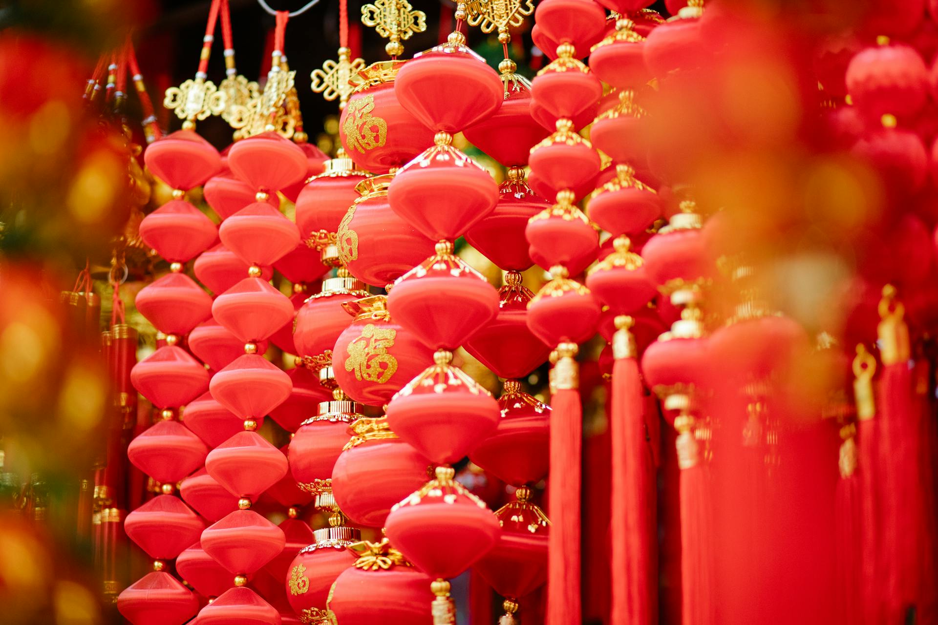 Red and golden Asian decorations hanging in local market