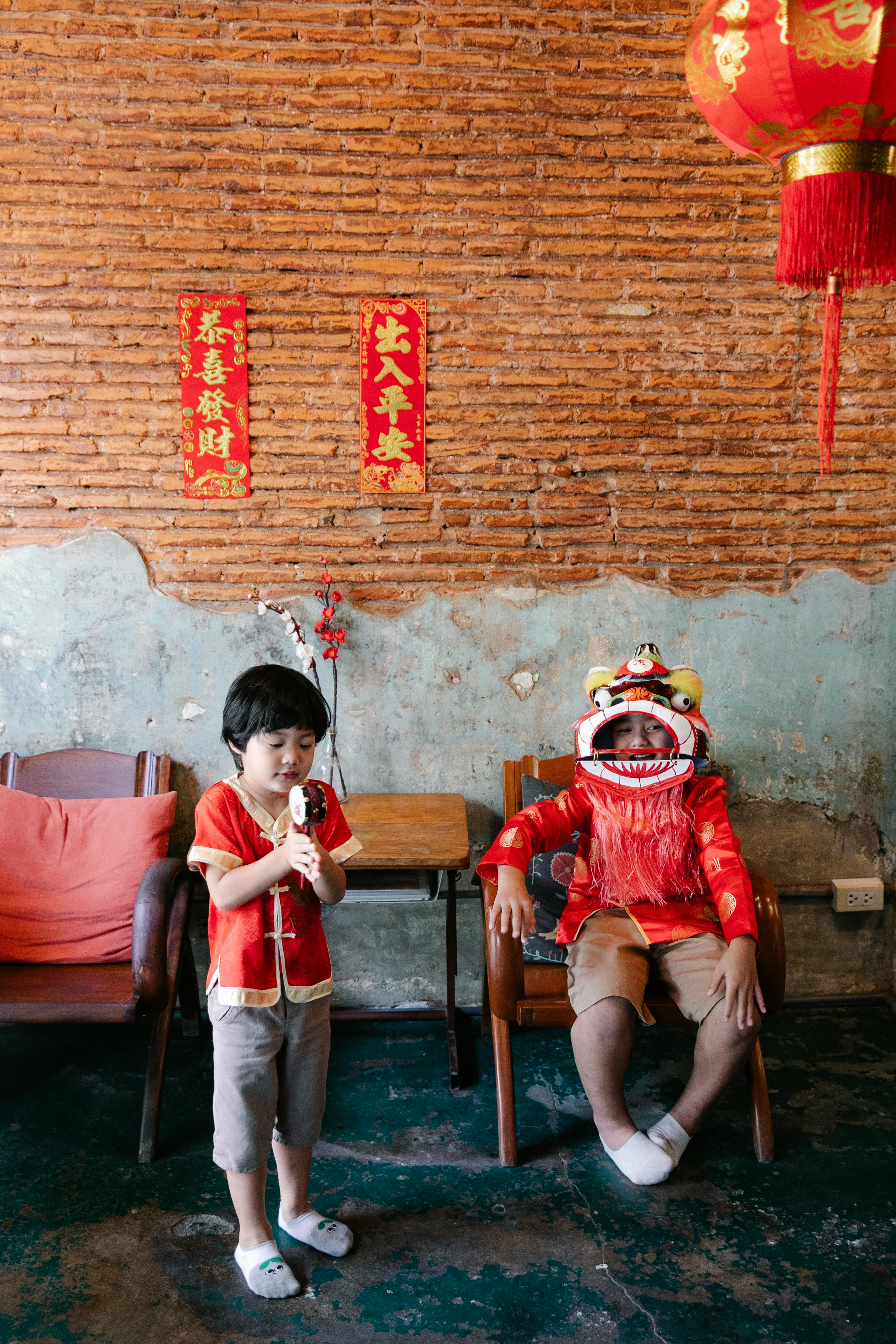 chinese kids in cute traditional costumes