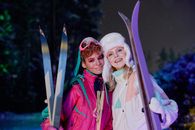 Man in Red Jacket Beside Woman in Red Jacket Holding Blue and White Snow Ski Blades