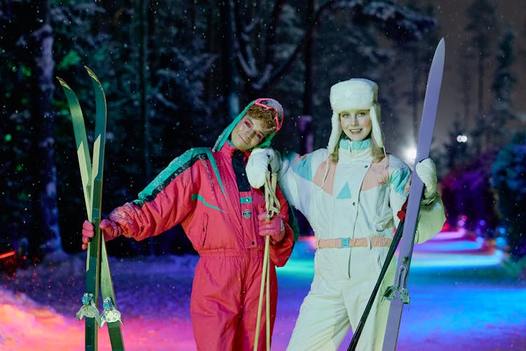 Two Women Holding Skis