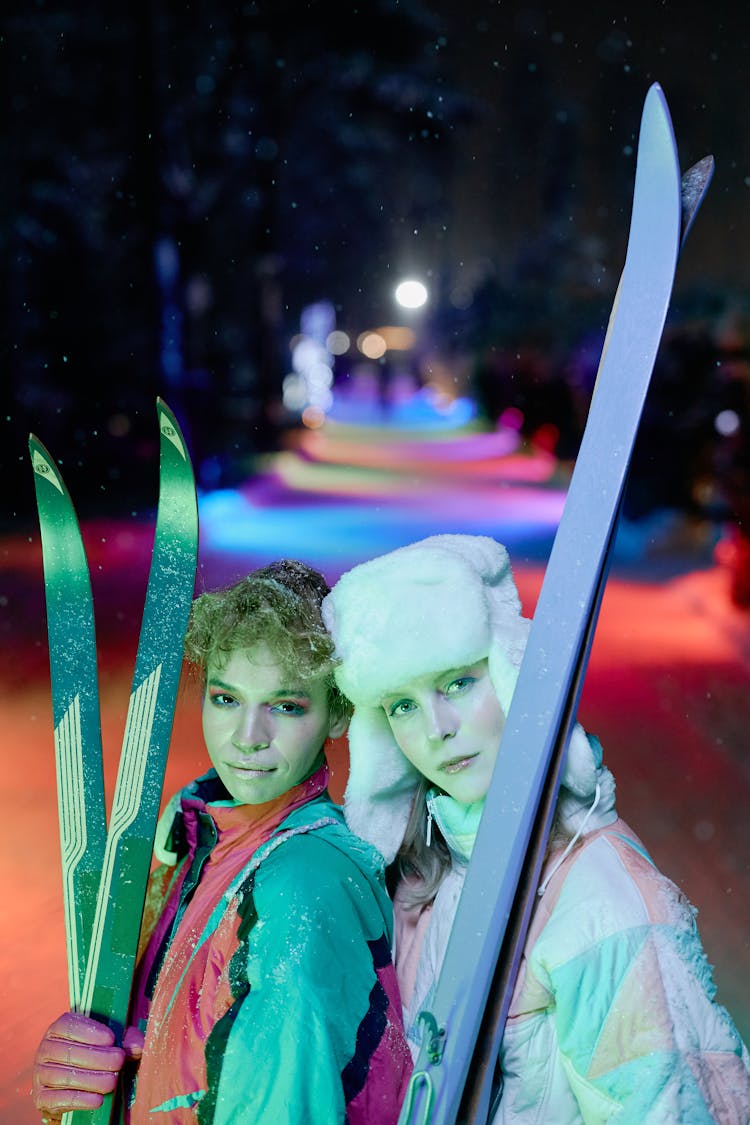 Two Women Holding Skis