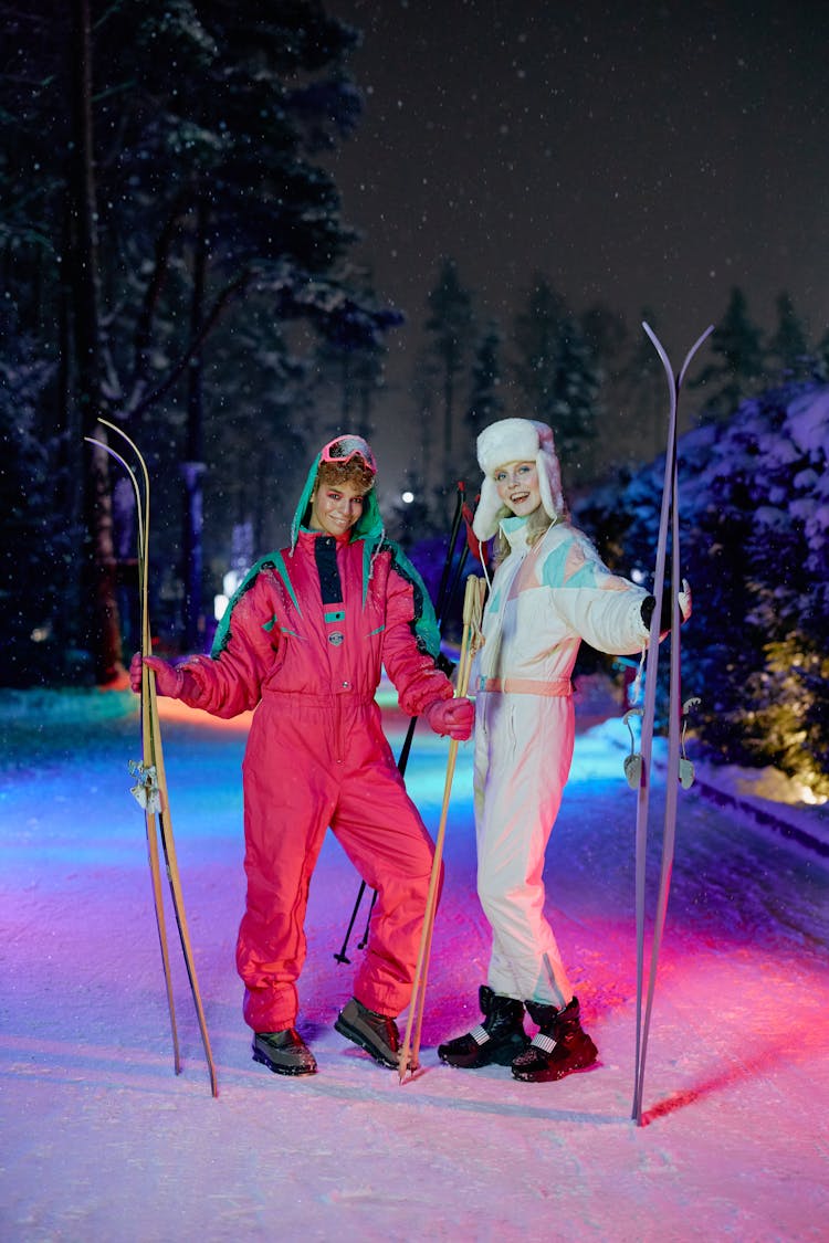 Woman Holding Skis Standing Together