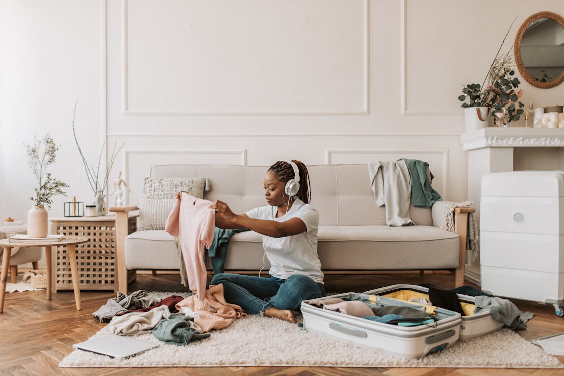 A woman packing her luggage to immigrate