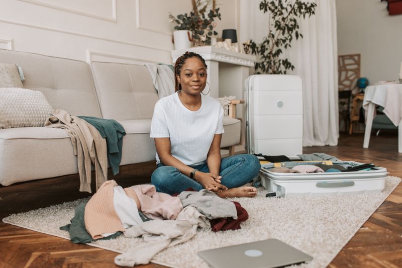 Traveler packing a suitcase at home, photo by Vlada Karpovich on Pexels
