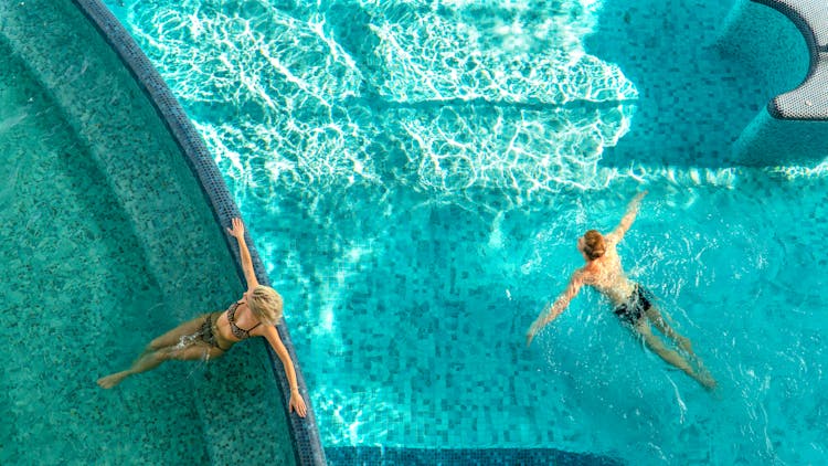 A Man And A Woman In A Swimming Pool