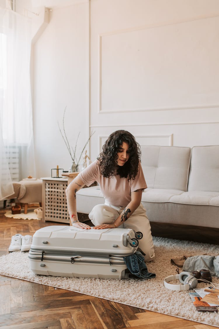 A Woman Packing Her Luggage