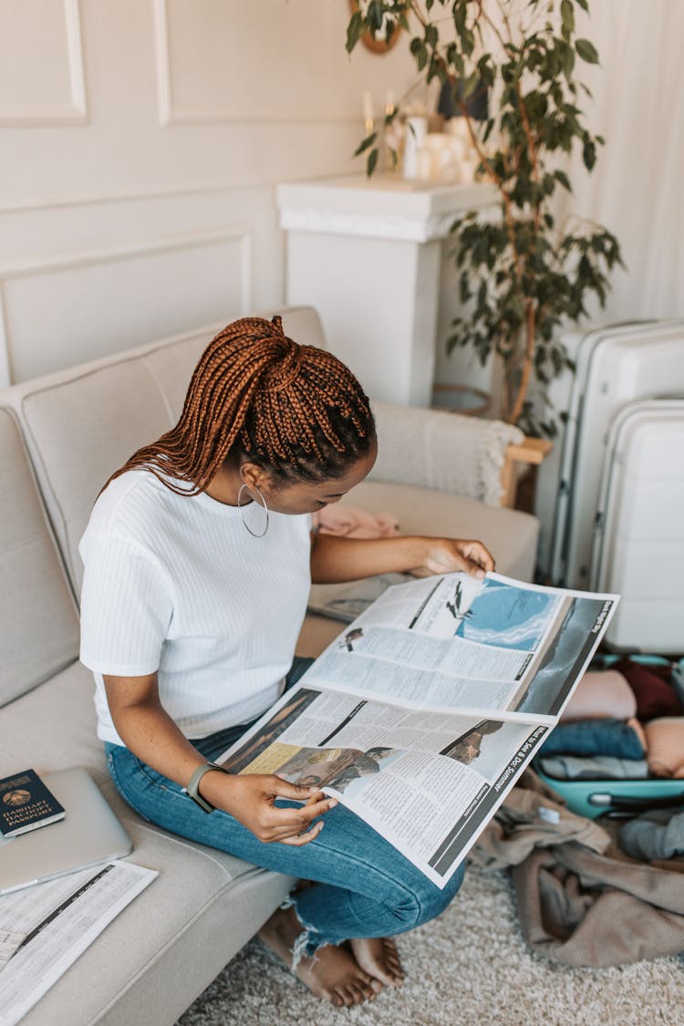 A Woman Reading A Magazine