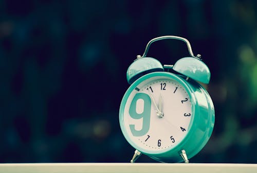 A Green and White Alarm Clock