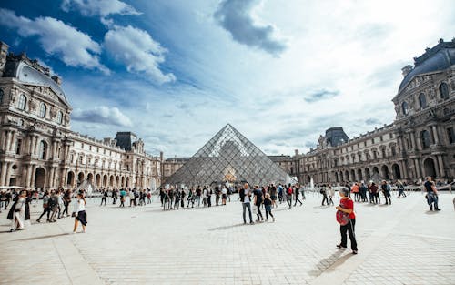 Free People Walking in Front of Louvre Museum Stock Photo