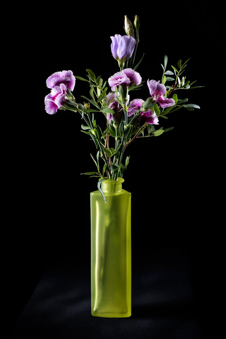 Purple And Pink Flowers In Yellow Glass Vase
