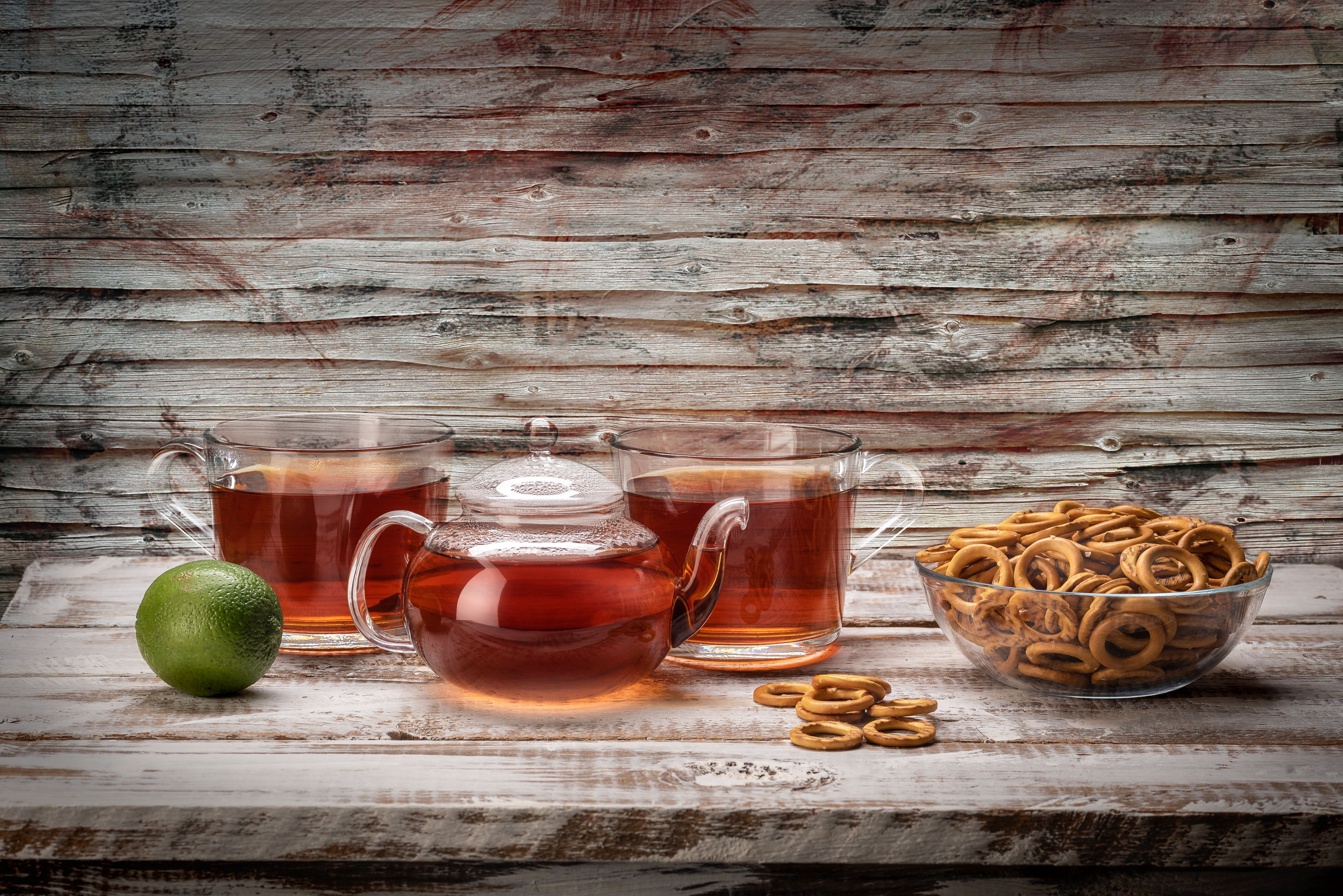 Still Life with Tea, Lime and Pretzels on Wood · Free Stock Photo