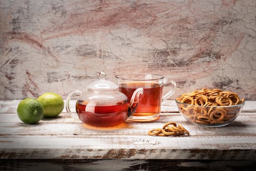 Clear Glass Teacup on the Table