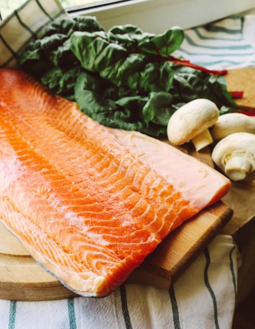 Raw Salmon on Wooden Chopping Board