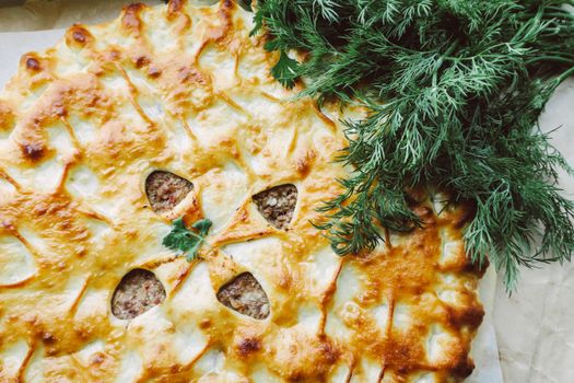 Delicious savory pie topped with fresh dill, perfect for gourmet meals.