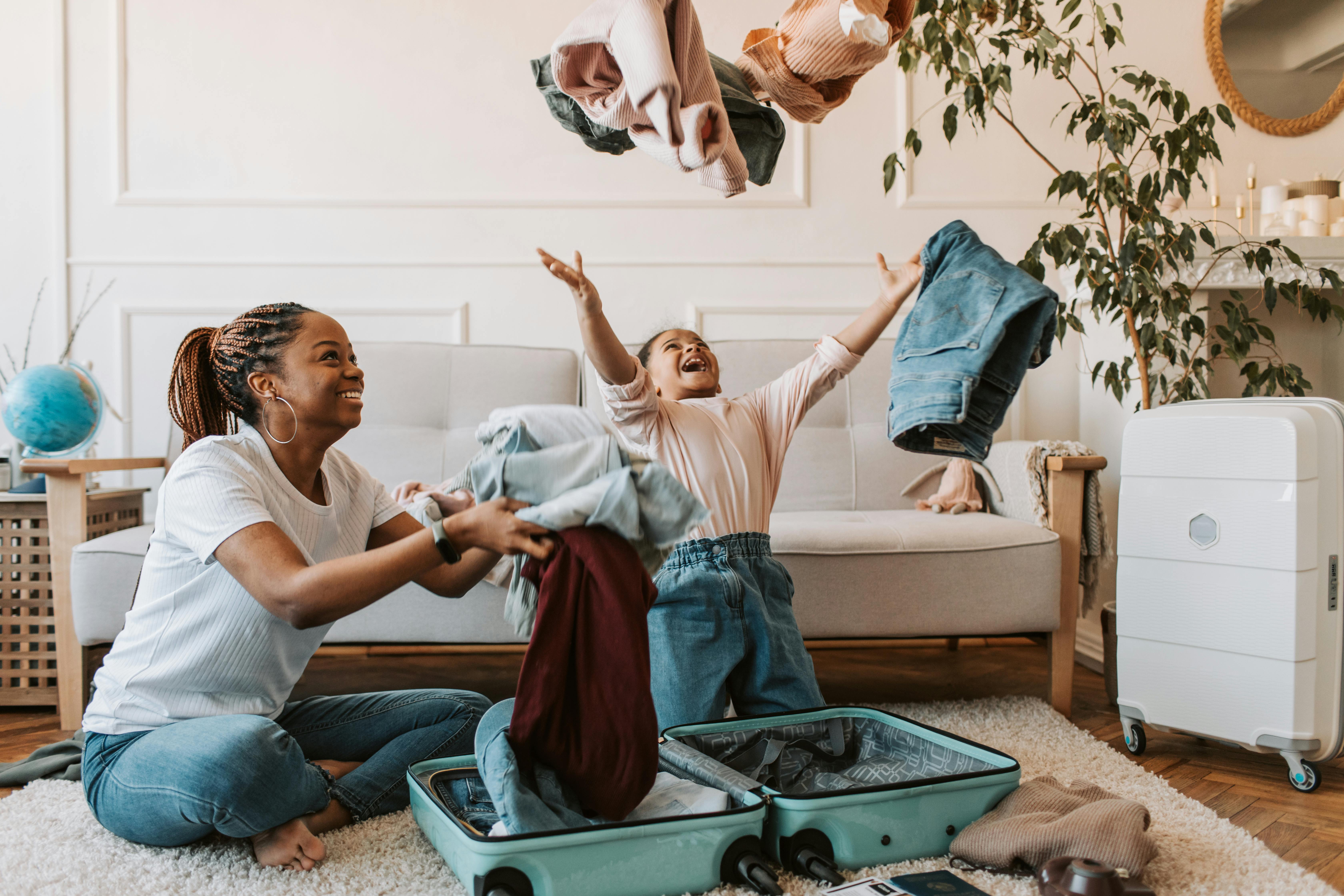 Free Mother and Daughter Playing with Clothes Stock Photo