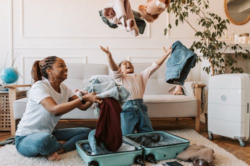 Free Mother and Daughter Playing with Clothes Stock Photo