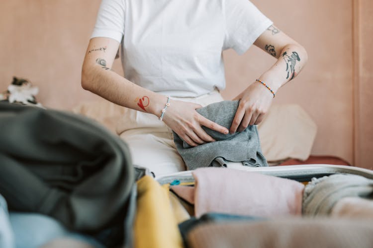 Woman Folding Clothes