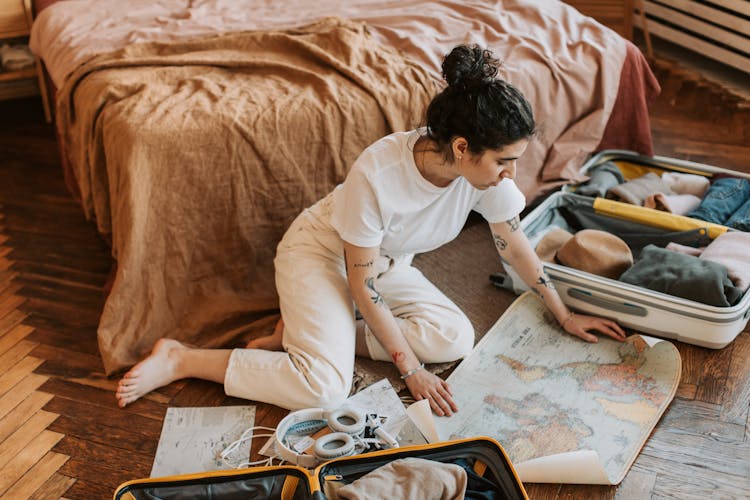 A Woman Looking At The Map