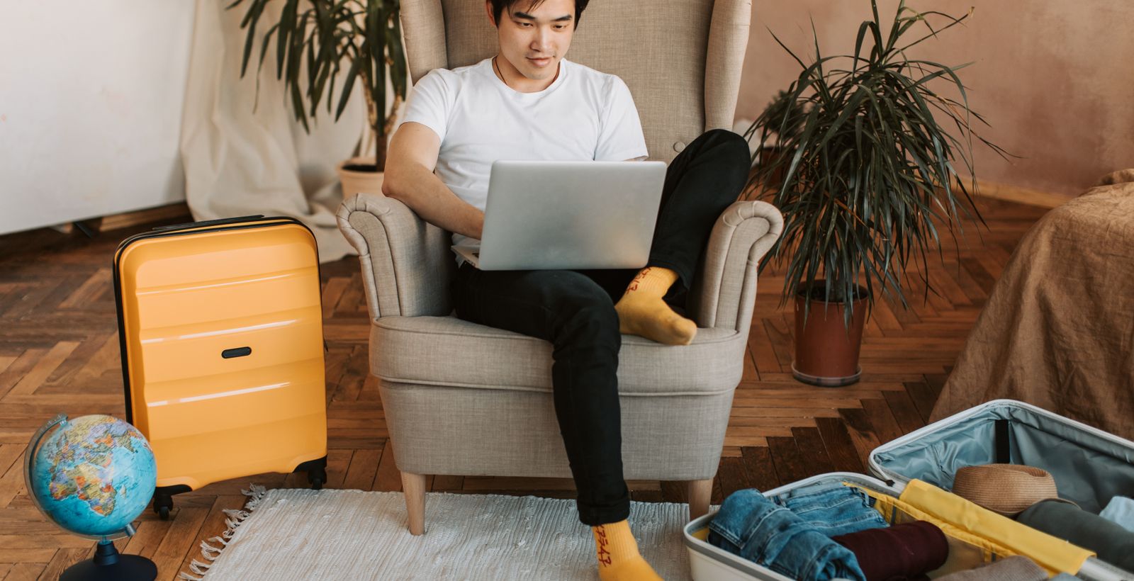 A person comparing hotel cancellation policies on a laptop while planning a trip