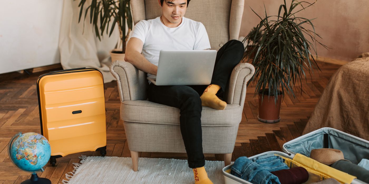 Person comparing hotel prices on a laptop to catch a price drop in 2026