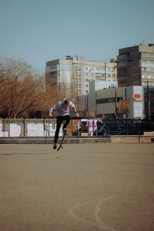 Free A Man Doing a Skateboard Trick Stock Photo