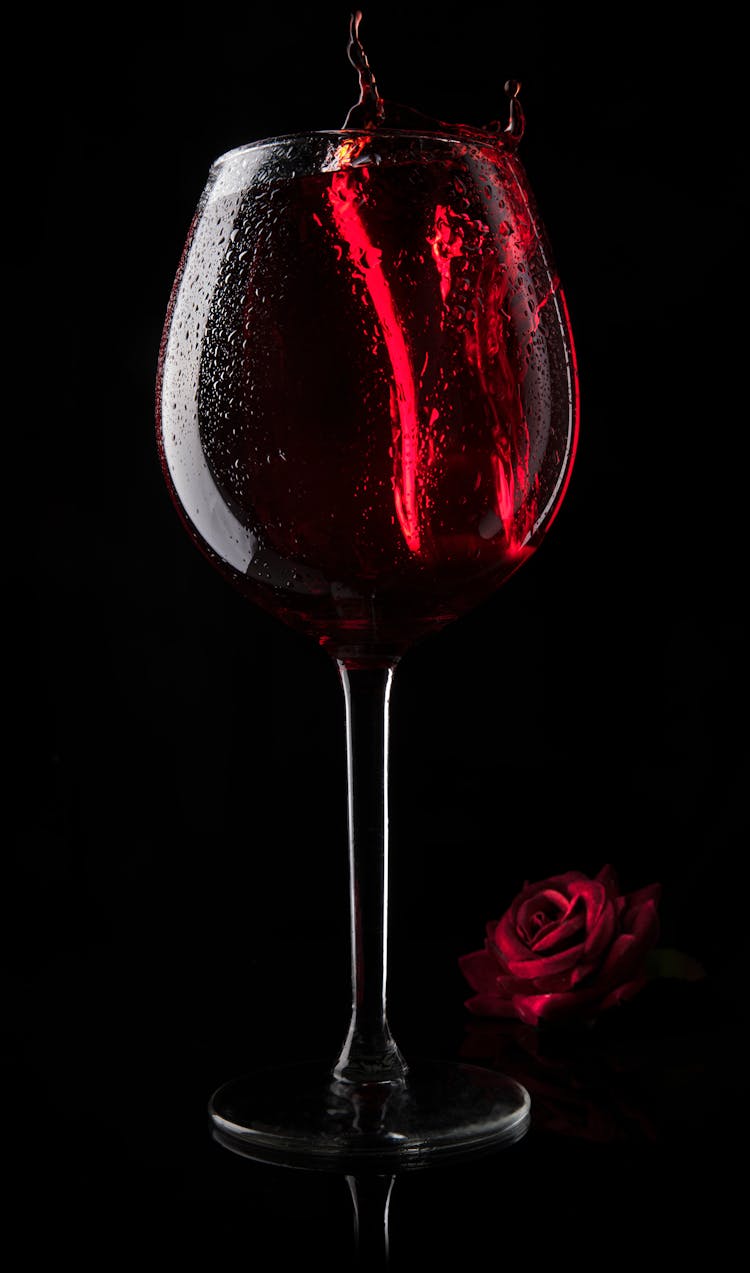 Red Wine Splashing In A Wine Glass