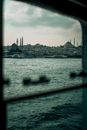 Through window of ferry on coastal city