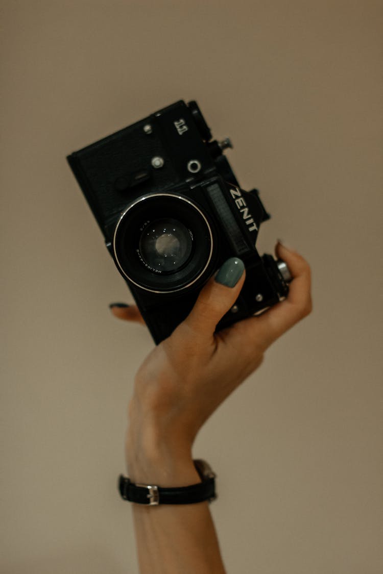 A Person Holding A Camera