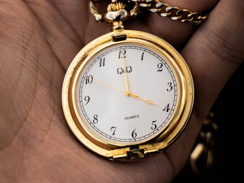 Free A Gold and White Analog Watch Stock Photo