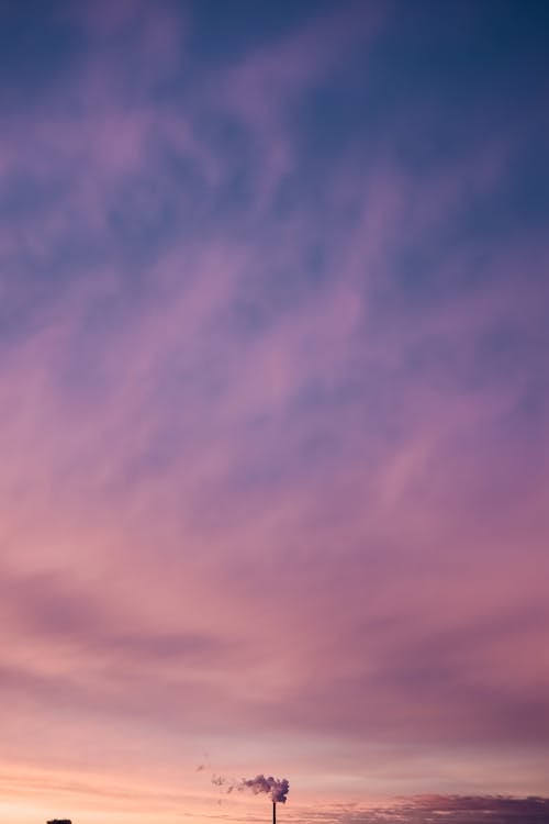 Colorful sundown sky with smoke · Free Stock Photo