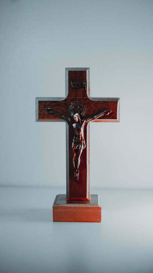 Brown Wooden Cross on White Table