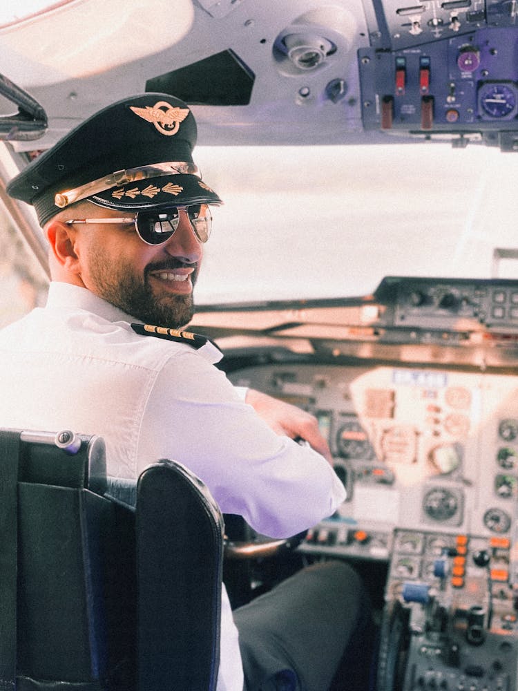 Pilot Sitting On A Cockpit 