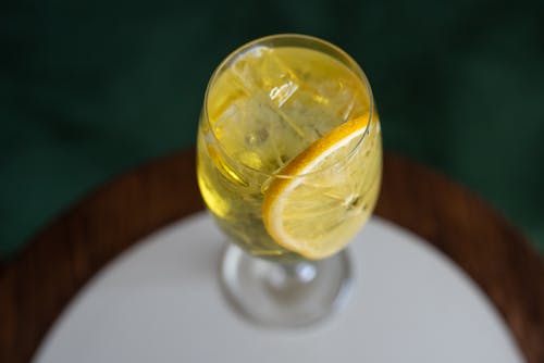 Free A Wine Glass with Sliced Lemon and Ice Stock Photo