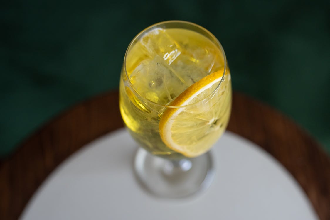 A Wine Glass with Sliced Lemon and Ice