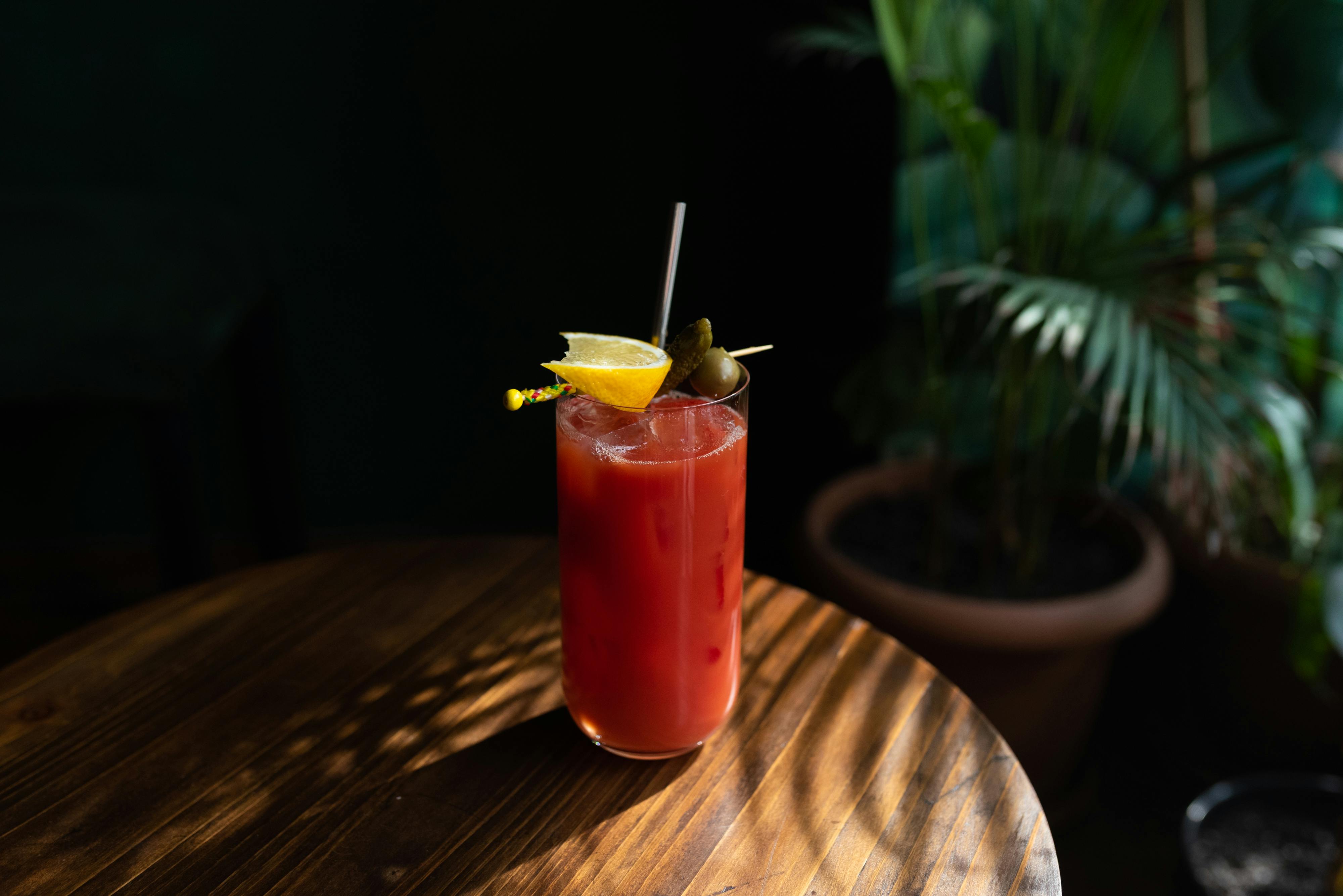 Cocktail shaker and fresh citrus fruits on a bar - classic cocktail recipes