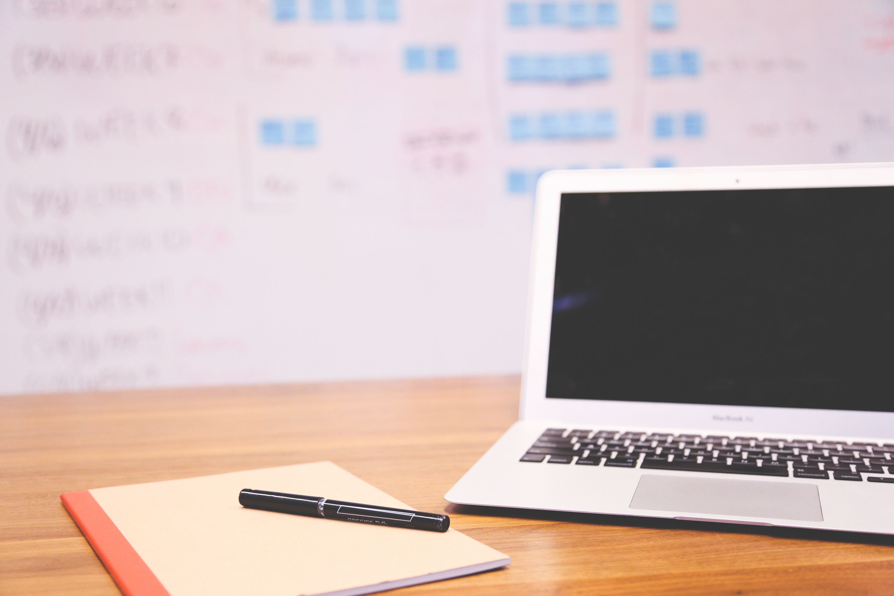 Turned Off Macbook Air Beside Black Pen On Book Free Stock Photo turned-off-macbook-air-beside-black-pen-on-book-free-stock-photo