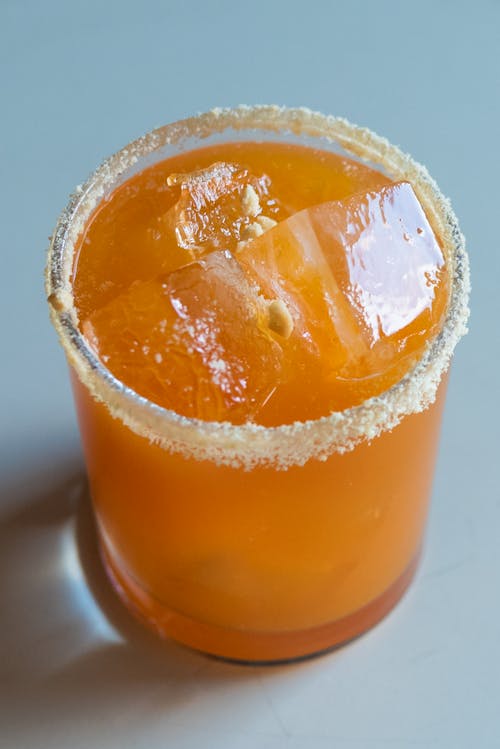 Orange Cocktail Drink on White Surface