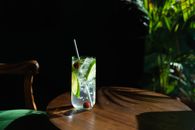 Clear Drinking Glass with Clear Liquid and Sliced Lime