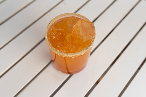 Orange Juice with Ice Cubes in a Glass
